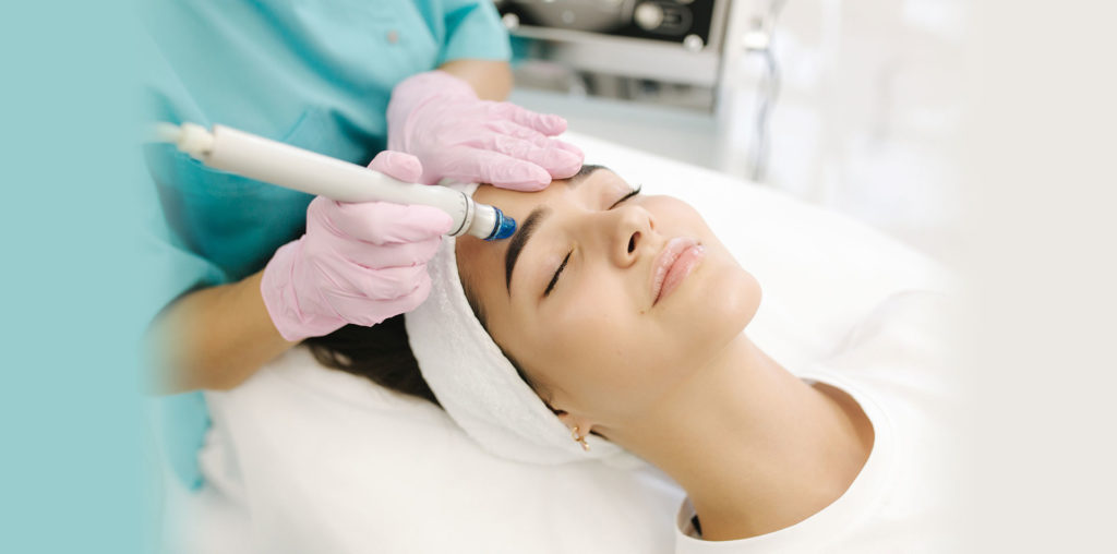 hydrafacial-bg Woman receiving skin resurfacing treatments at Vitalyc